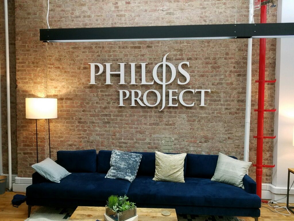 Custom Philos Project White Wall Lobby Signage in New York