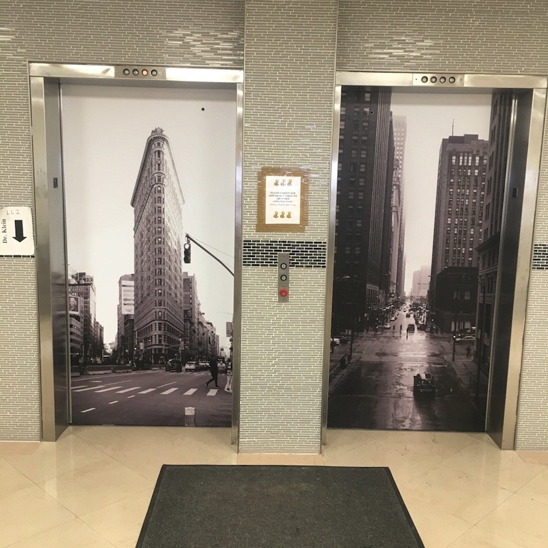 street style sign elevator wraps