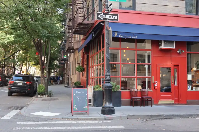 A-frame chalkboard sign outside NYC restaurant sidewal