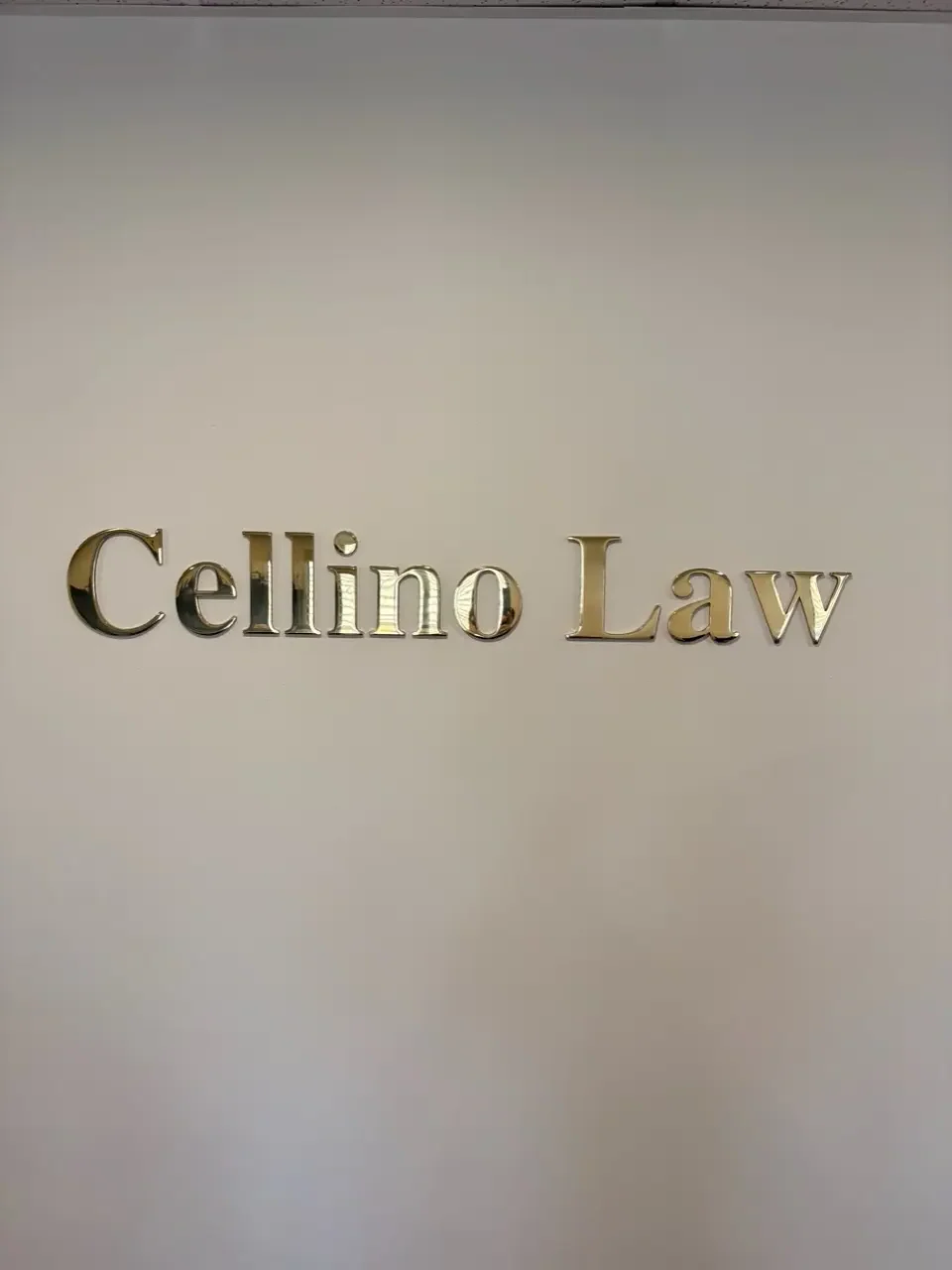 Brass dimensional lobby lettering for Cellino Law's New Jersey office.