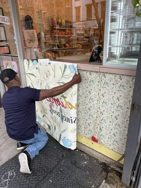 Storefront window at Confectionery in Manhattan, NY, before the first-surface cut vinyl graphic installation.