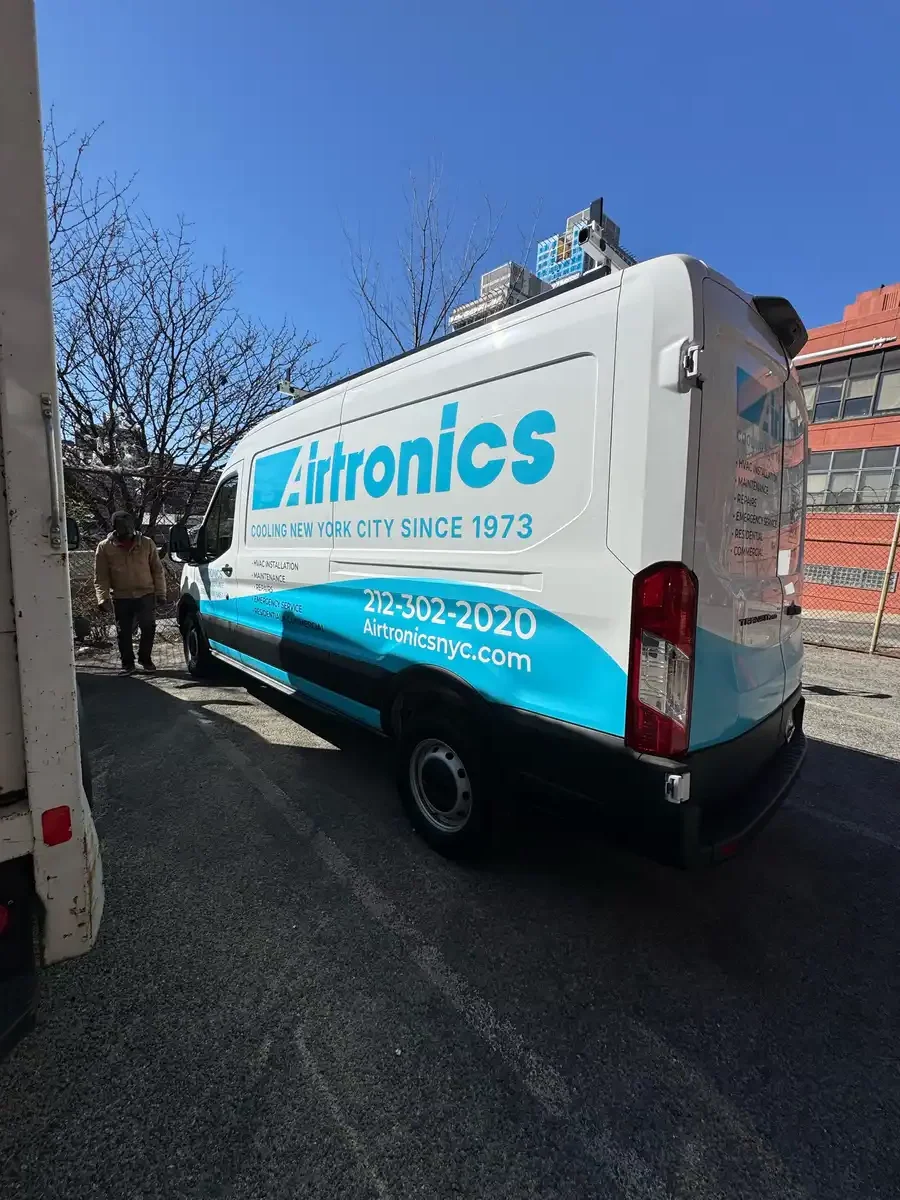 Custom vehicle wrap on a Ford Transit van for Airtronics, installed in the Bronx, NY.
