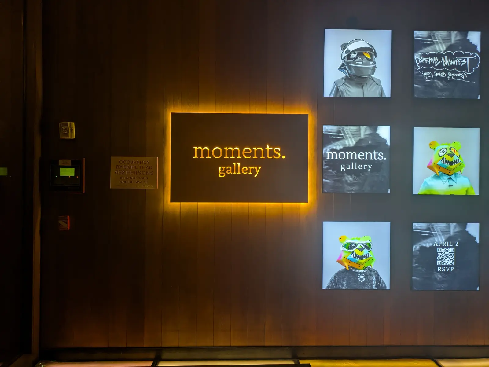 Illuminated, backlit dimensional wall sign on ACM panel for Moments Gallery, Manhattan, NY.