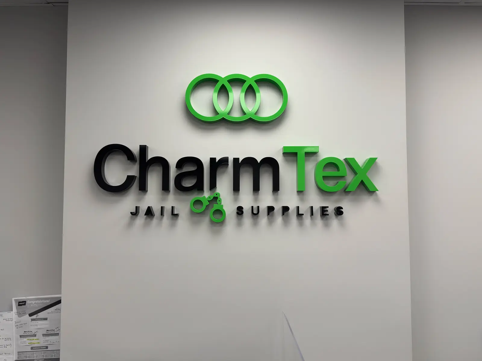 Flush-mounted painted acrylic interior sign for Charmtex, Brooklyn, NY.