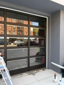 professional window privacy film installation on a glass storefront in New York City