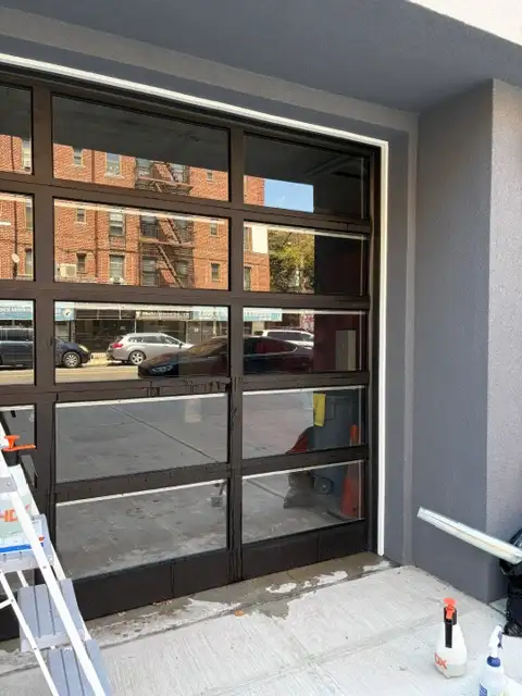 professional window privacy film installation on a glass storefront in New York City