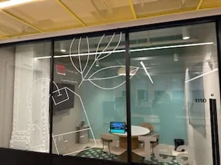 Glass meeting room with line art film
